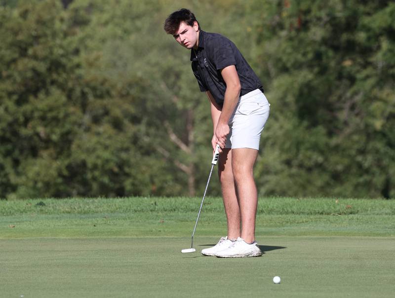 Kaneland’s Brayden Seaton putts on the third green Monday, Sept. 23, 2024, during the Interstate 8 boys golf tournament at the Kishwaukee Country Club in DeKalb.