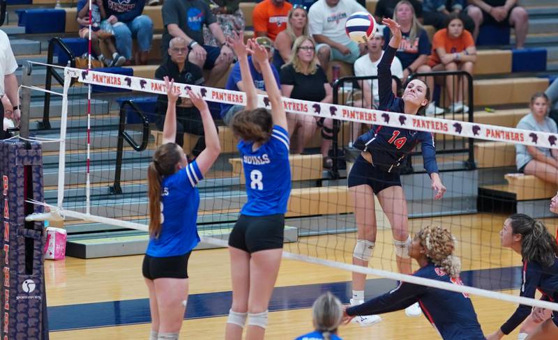 Oswego’s Mia Jurkovic (14) goes up for kill against Rosary’s Katie Phillippe (13) and Sarah Nierman (8) during a volleyball match at Oswego High School on Tuesday, Aug 29, 2023.
