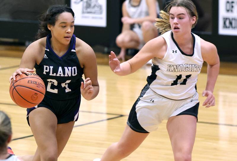Plano’s Mikayla Walls goes to the basket against Kaneland’s Berlyn Ruh during their game Tuesday, Dec. 13, 2022, at Kaneland High School in Maple Park.