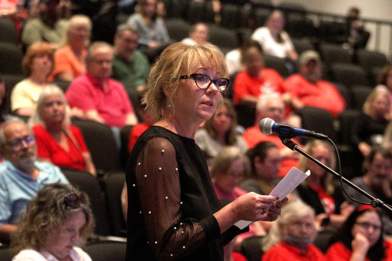 Valley View Elementary School teacher Jennifer Brown speaks in favor of a Jack Pease proposal to mine 110 acres at Route 120 and Chapel Hill Road as the McHenry City Council met on Monday, Aug. 7, 2023, at McHenry High School’s Upper Campus auditorium. Valley View lies near a gravel pit, and Brown offered testimony of experiencing no adverse effects from the gravel pit.
