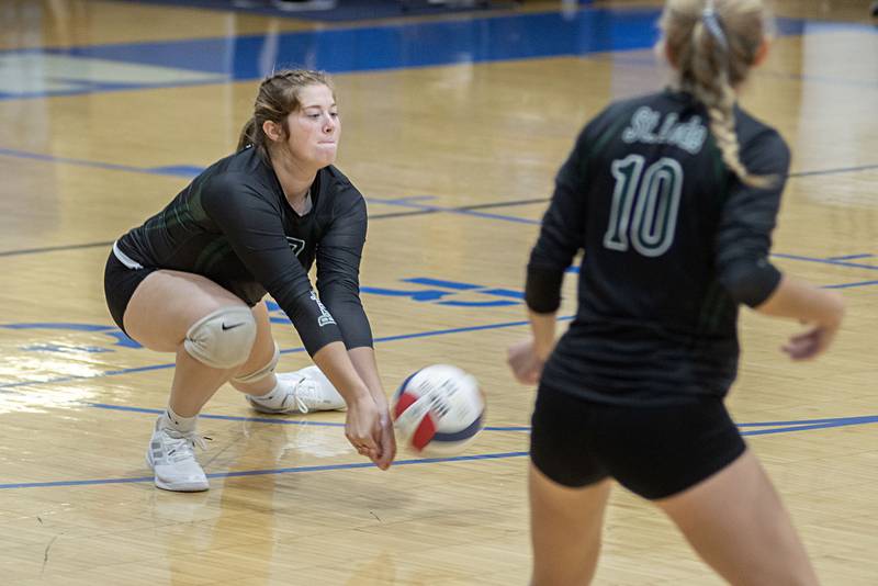 St. Bede’s Reagan Stoudt digs a ball against Newman Tuesday, Sept. 27, 2022.