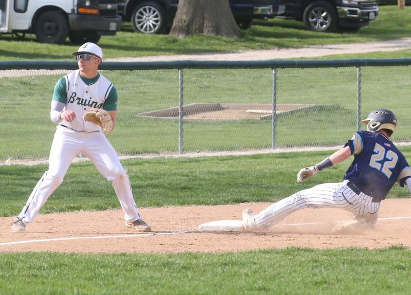 Marquette's Griffin Dobberstein steals third base as St. Bede's Aidan Mullane waits for the late throw on Thursday, April 24, 2025 at St. Bede Academy.