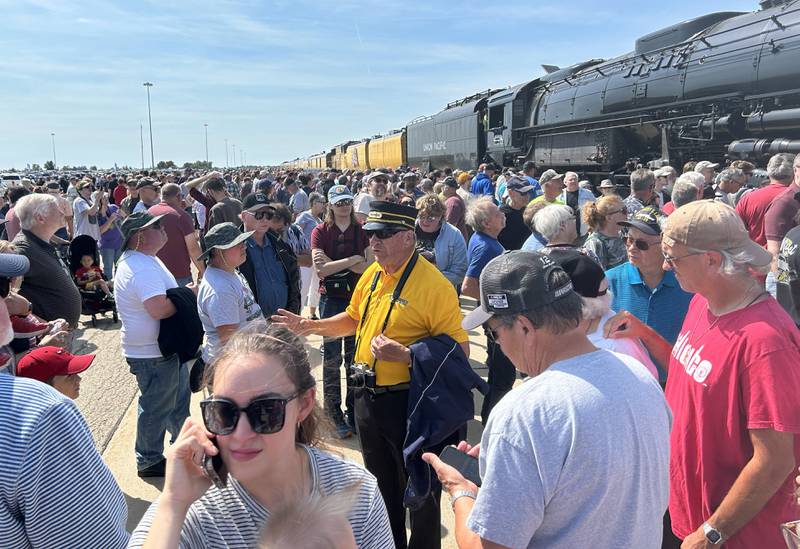 A man talks about the history of Union Pacific's Big Boy 4014 vintage steam locomotive on Sunday, Sept. 8, 2024. An estimated 61,000 people visited the steam locomotive at the UP Global II terminal during the daylong, free event in Rochelle. The visit was part of Union Pacific’s eight-week “Heartland of America Tour,” which started Aug. 29, in Cheyenne, Wyoming, and continues across nine states.