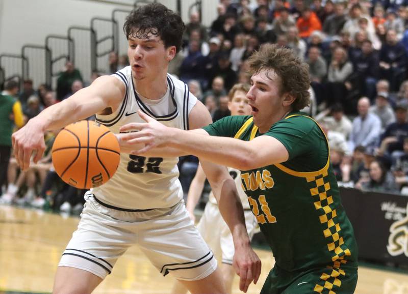 Crystal Lake South’s Ryan Morgan, right, races Cary-Grove’s Adam Bauer for the ball in boys IHSA Class 3A Regional Championship basketball on Friday, Feb. 27, 2026, at Crystal Lake South High School in Crystal Lake.