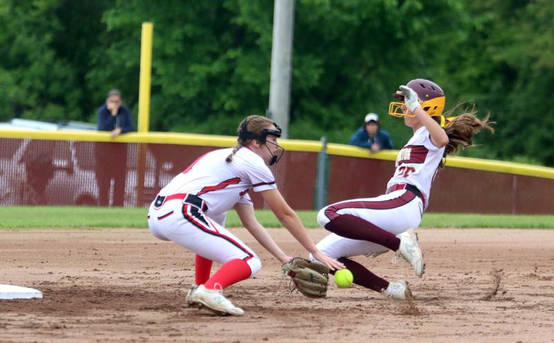 Richmond-Burton’s Mia Spohr, right, is safe as Stillman Valley’s Ellie Larson gathers the throw at second base in softball sectional title game action in Richmond Friday evening.