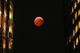 A total lunar eclipse will turn the moon blood red on Tuesday across several continents