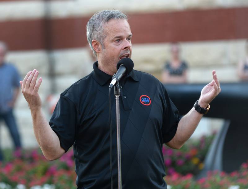 Mike Koolidge, chairman of the Ogle County Republicans, speaks at a candlelight vigil for Charlie Kirk in downtown Oregon on Sunday, Sept. 14, 2025.