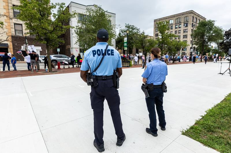 Members of the Joliet Police Department are on hand during the Good Trouble Lives On event in Downtown Joliet on July 17, 2025.