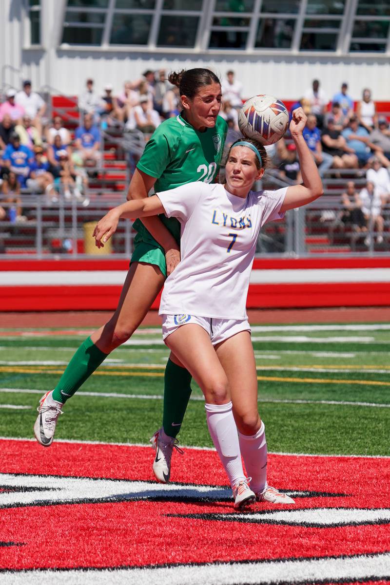 York’s Mia Barton (20) and Lyons’ Caroline Mortonson (7) fight for position in the box on a Lyons corner kick in a Class 3A Hinsdale Central Sectional girls soccer championship match at Hinsdale Central High School on Saturday, May 25, 2024.