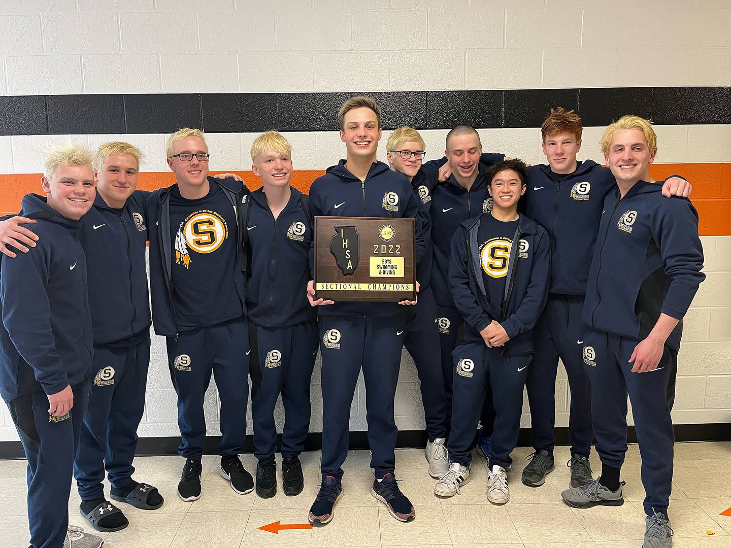 The Sterling Water Warriors pose with the sectional championship plaque after they won the United Township Sectional on Saturday in East Moline.
