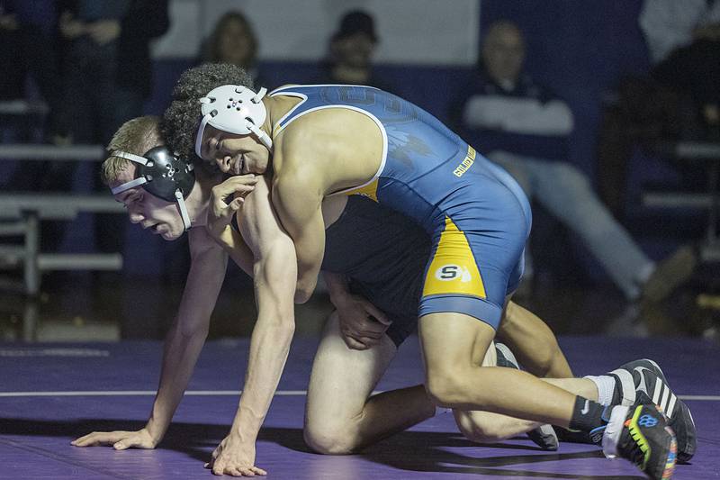 Sterling’s Tatum Allen (right) works against Dixon’s Konnor Koehler at 152 poundsTuesday, Jan. 10, 2023. Allen won by major decision.