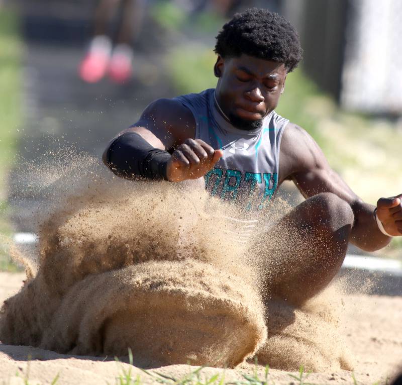 Woodstock North’s JR Fadahunsi competes in the long jump in KRC Conference Track Meet action at Richmond-Burton High School in Richmond on Tuesday, May 13, 2025.