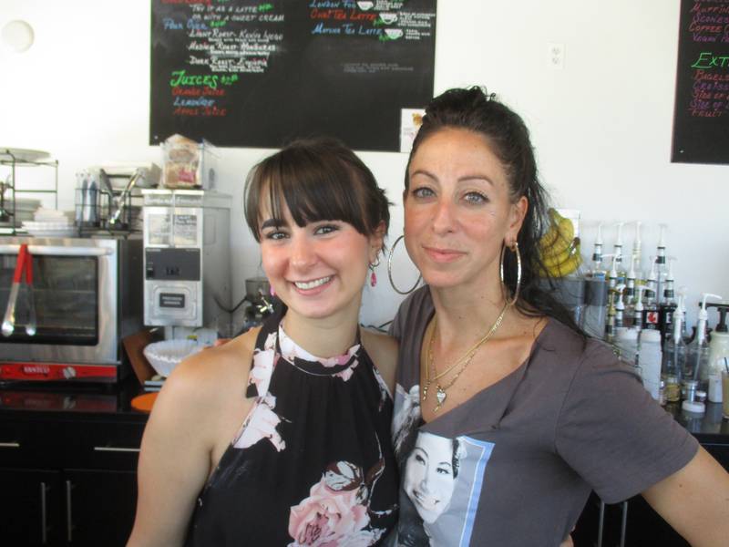 Laura Intrain of Yorkville, right, is the owner of the new Iconic Coffee Shop in downtown Yorkville. Intrain is seen here with barista Julie Schimpf of North Aurora.