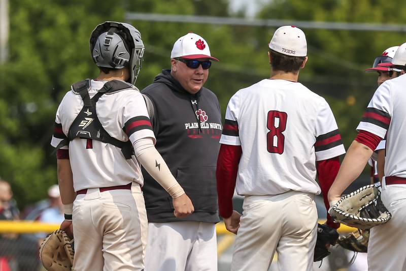 Plainfield North's head coach John Darlington visits the mound during Class 4A Plainfield North Regional final baseball game between Oswego at Plainfield North. Saturday, May 31, 2025 in Plainfield.