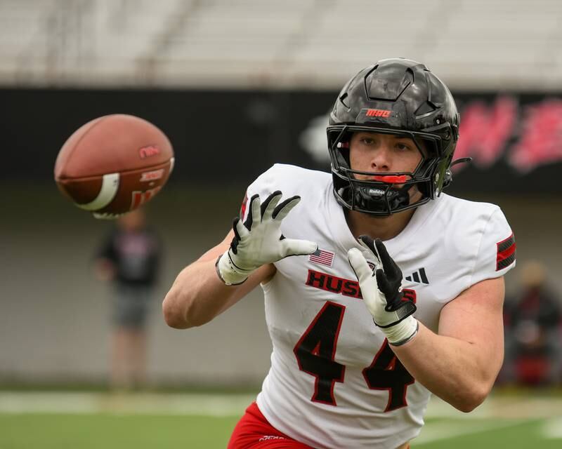 Northern Illinois University's Christian Fuhrman (44) works on warm up drills before the scrimmage on Saturday April 27, 2024, held at Huskie Stadium in DeKalb.