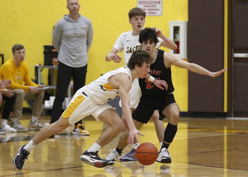 Jacobs' Ben Jurzak drives to the basket against McHenry's Marko Visnjevac during a Fox Valley Conference basketball game Wednesday, Dec. 7, 2022, between Jacobs and McHenry at Jacobs High School in Algonquin.