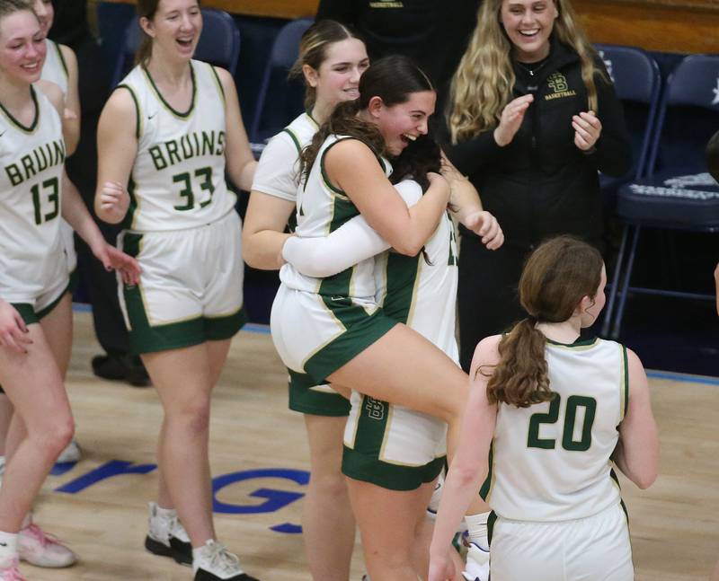 St. Bede's Jenna Ladzinski reacts after being lifted up by teammate Ali Bosnich as the Lady Bruins win the Class 1A Regional semifinal game over Marquette on Monday, Feb,. 12, 2024 in Bader Gym.