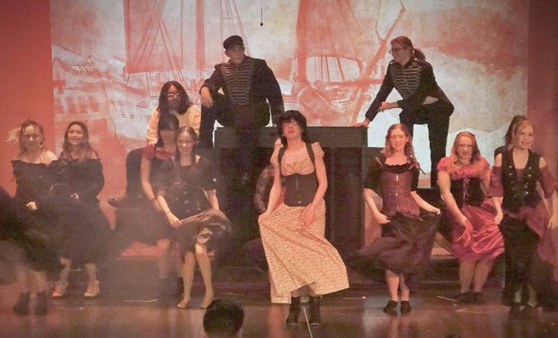 The cast of  "Les Miserabels" acts out a scene  in Matthiessen Memorial Auditorium at La Salle-Peru Township High School.
