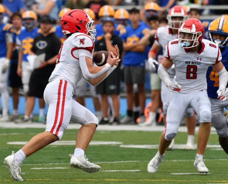 Hinsdale Central’s Nicholas Mann (let) makes a key interception late in the game against Lyons Township on September 20, 2025 at Lyons Township High School in LaGrange.