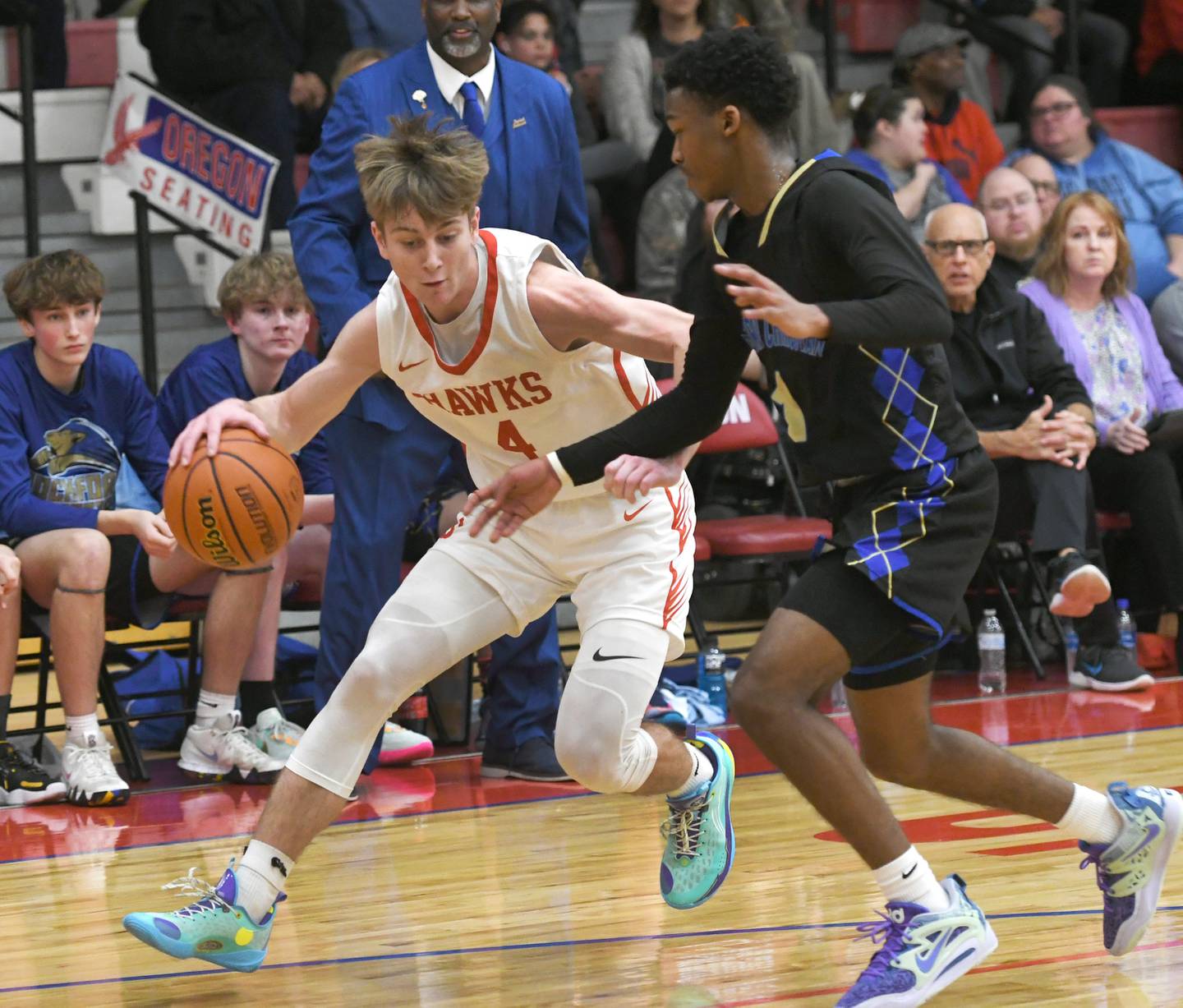 Oregon's Jameson Caposey tries to avoid a Rockford Christian defender during a Jan. 6 game at the Blackhawk Center.