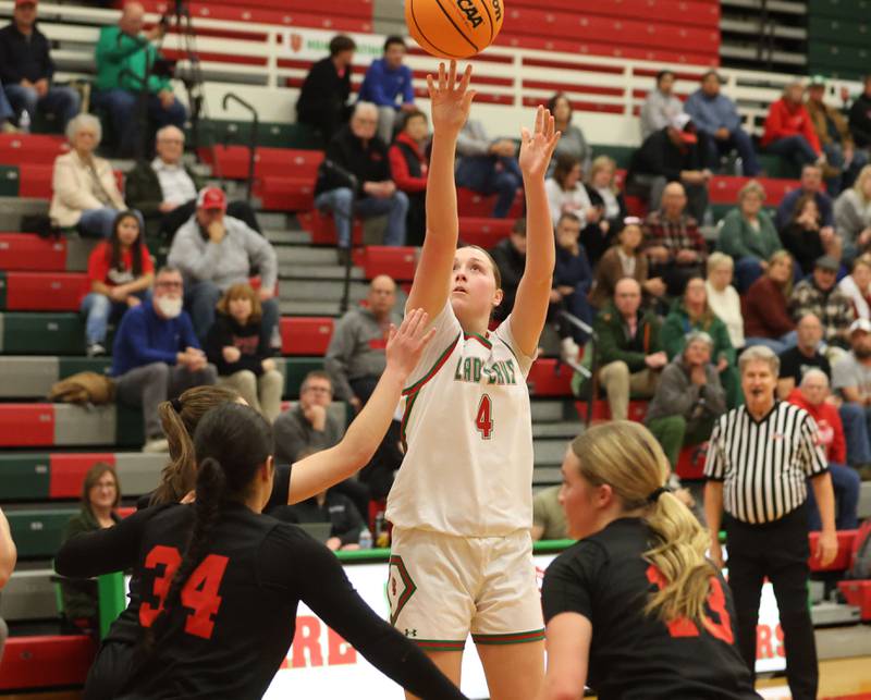 L-P's Alexus Hines shoots a jump shot over Hall's Natalia Zamora and Caroline Morris on Monday, Jan. 12, 2026 in Sellett Gymnasium at L-P High School.