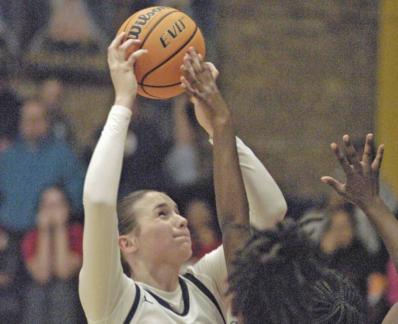 Sterling's Madison Austin shoots the ball over a Rock Island defender. Western Big 6 conference champions Sterling hosted Rock Island in girls basketball. The action took place Thursday, February 13, 2025 at Musgrove Fieldhouse at SHS.