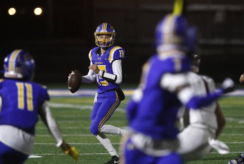 Johnsburg's Carter Block looks to pass during a Kishwaukee River Conference football game against Marengo on Friday, Oct. 4, 2024, at Johnsburg High School.