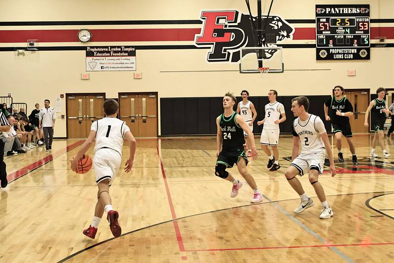 EP Panther Caleb Brown secures the ball while the clock runs out giving the Panthers a 57-53 victory over the visiting Rock Falls Rockets Monday, Dec. 1, 2025,  in Prophetstown for the first ever Turkey Shoot Out.