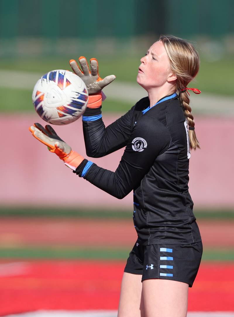 Hinsdale Central goalkeeper Katherine Skinner warms up pre-match during the girls varsity soccer match between Lyons Township and Hinsdale Central high schools in Hinsdale on Tuesday, April 18, 2023.