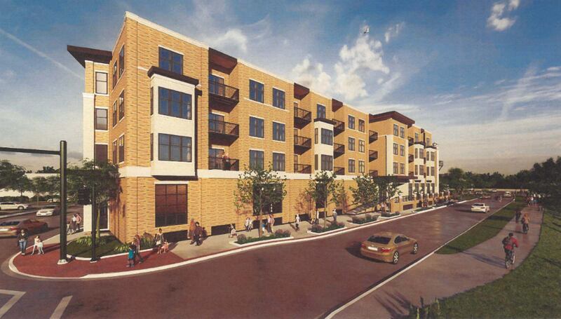 Frontier Development on Monday was given the green light to proceed with its proposed River East Lofts apartment project near the Fox River after revising its plans.