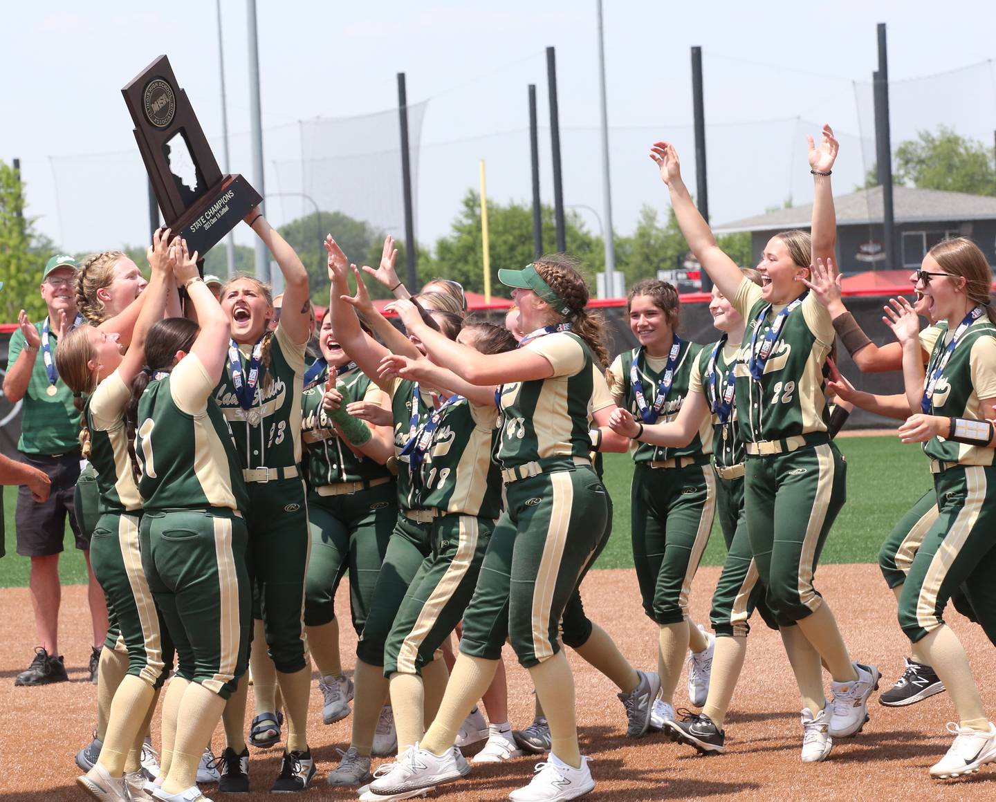 Members of the St. Bede softball team hoist the Class 1A State championship trophy after defeating Illini Bluffs on Saturday, June 3, 2023 at the Louisville Slugger Sports Complex in Peoria.