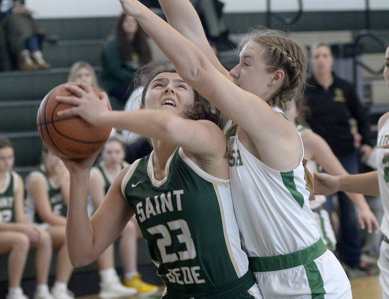 St Bede’s Ali Bosnich shoots against Seneca’s Ella Sterling Tuesday at St Bede.