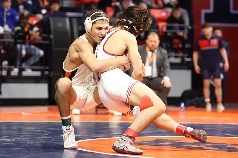 Dekalb’s Tommy Curran brings down Moline’s Noah Tapia in the Class 3A 145lb. championship match at State Farm Center in Champaign. Saturday, Feb. 19, 2022, in Champaign.