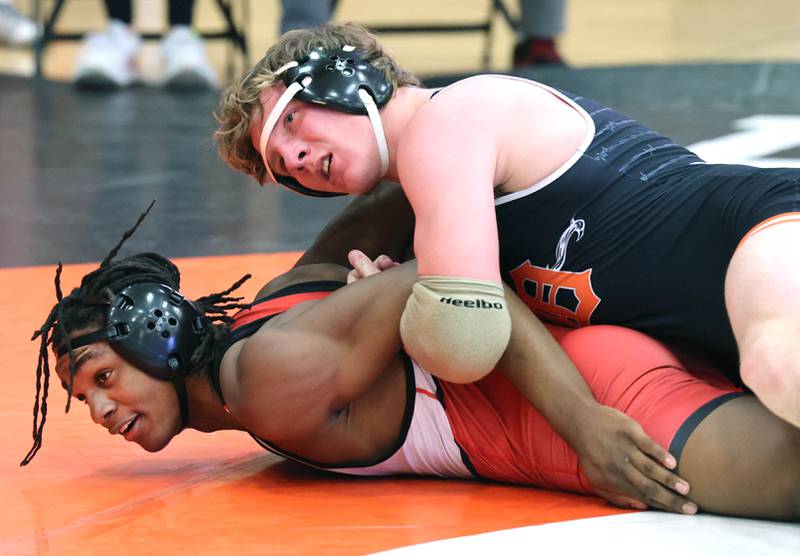 DeKalb’s Nate Sauer wrestles Naperville Central’s Nyree Dabney in a 182 pound semifinal match Friday, Jan. 20, 2023, during the DuPage Valley Conference wrestling tournament at DeKalb High School.