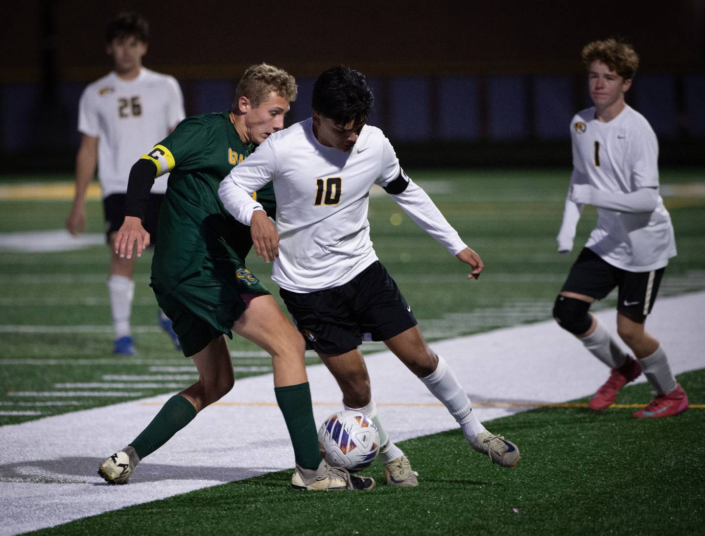 Herscher's Luis Parra controls the ball as Coal City's Luke Munsterman, left, challenges in a sectional game on Tuesday, October 28, 2025.