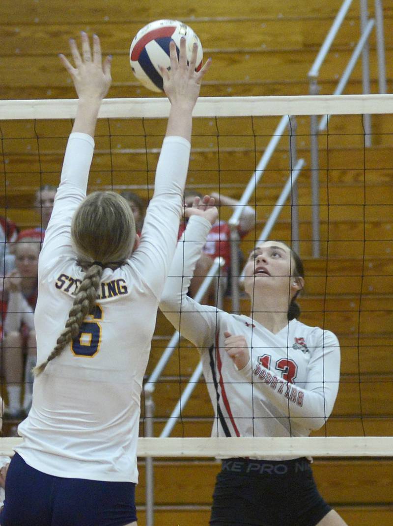 Sterling’s Elexa Varden sets to block a shot by Streator’s Mya Zavada during the first match Tuesday at Streator.