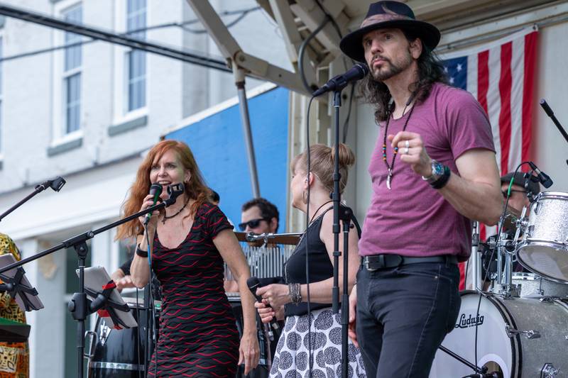 (left to right) Julie Leuck of “Brass From The Past” sings whilst Paula Mcevers and Jeff Anthony dance at the annual Shrimp Fest on Saturday, June 7, 2025 at Rotary Park in Princeton.