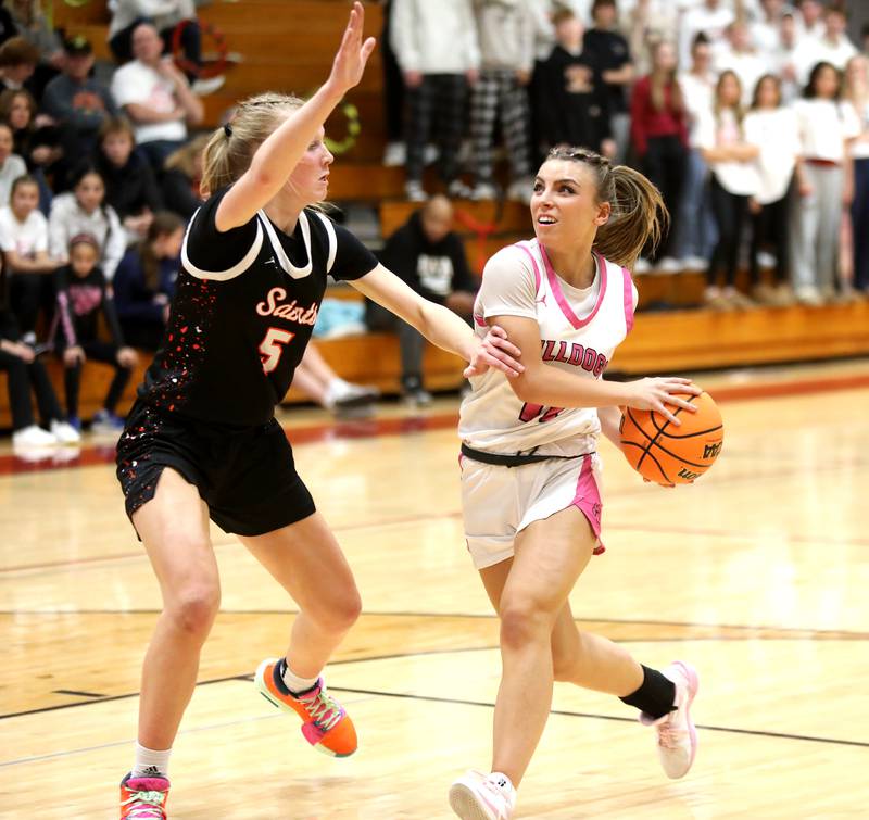 Batavia's Kaidyn King goes up for a shot past St. Charles East's Brooklyn Schilb during a game on Thursday, Feb. 6, 2025 in Batavia.