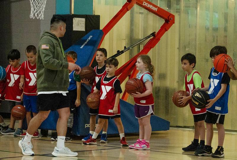 David Parker, at left, works with children at a YMCA basketball event. Parker, who most recently served as Regional Executive Director with the YMCA of Columbia-Willamette in Oregon, will be the Kankakee Area YMCA's new Chief Executive Officer, effective May 26, 2025.