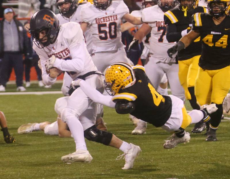 Rochester's Parker Gillespie breaks free of a tackle by St. Laurence's Nolan Ryan to score a touchdown during the Class 4A State football championship on Friday, Nov, 24, 2023 at Hancock Stadium in Normal.