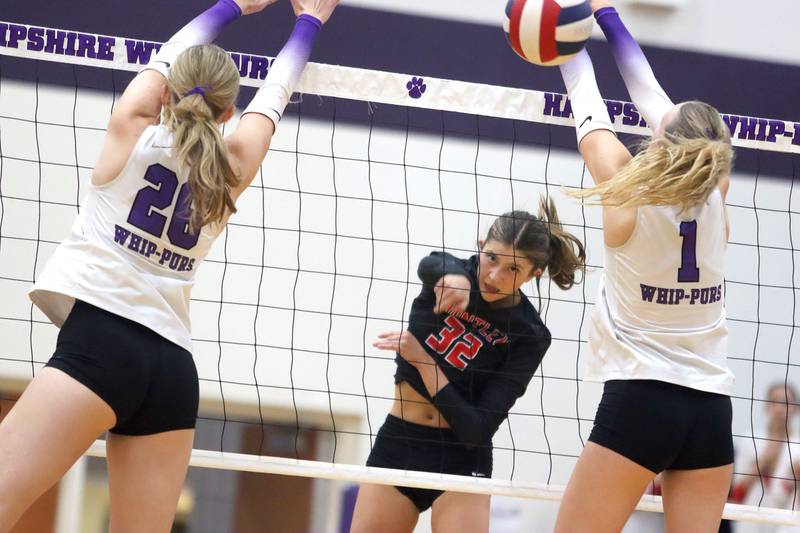 Huntley’s Izzy Whitehouse hammers the ball over the net  in varsity girls volleyball at Hampshire High School in Hampshire on Tuesday, Sept. 23, 2025.
