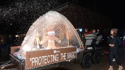 Erie’s lighted parade included snow thanks to one downtown business