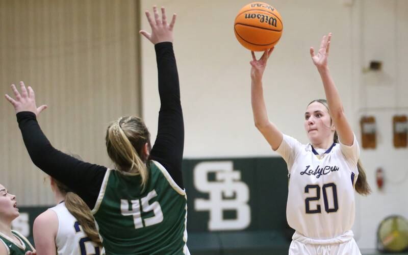 Marquette's Kaitlyn Davis lets go of a jump shot over St. Bede's Savannah Bray during the Class 1A Regional semifinal game on Tuesday, Feb. 18, 2025 at St. Bede Academy.