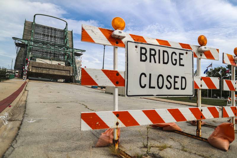Road signs note the continued closure of the Jefferson Street Bridge on Monday, Aug. 23, 2021, in Joliet, Ill.