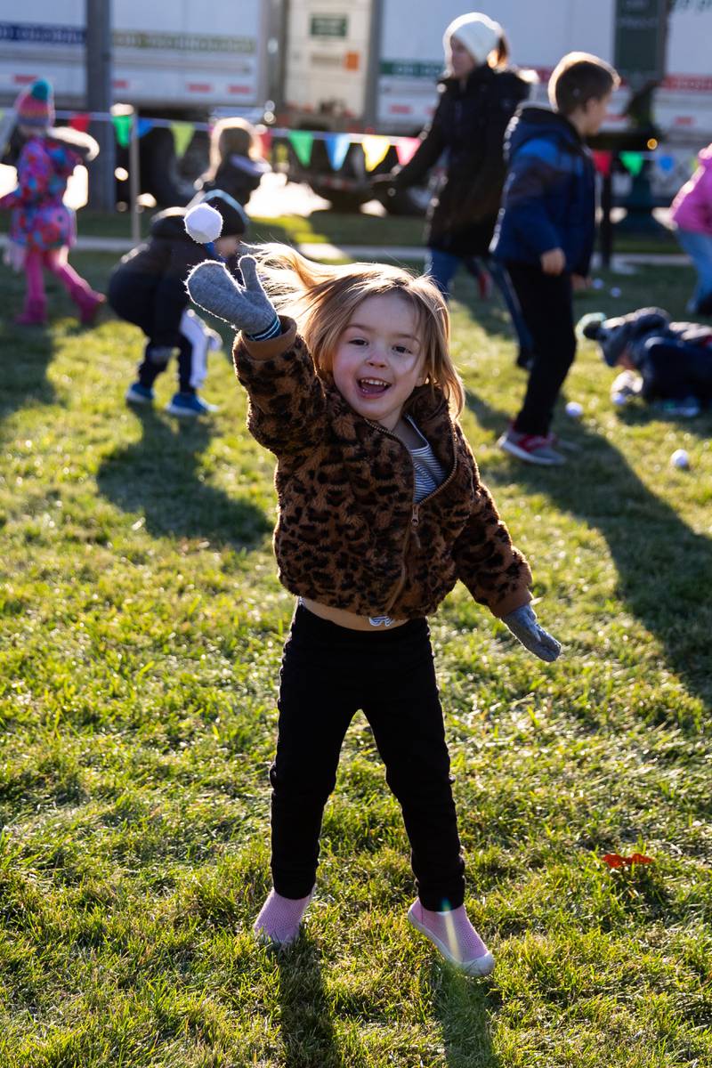 Emily Farano, of Joliet, has fun in the Snowball Fight Field at Christmas in the Square in Lockport on Saturday, Nov. 25, 2023.