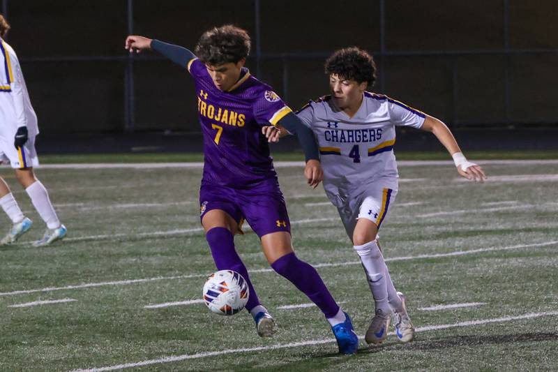 Isaac Diaz of Mendota dribbles ball past Alan Acosta of Aurora Central Catholic High School on Saturday, November 2, 2024 at Richard E. Phalen, SR. Field in Mendota.