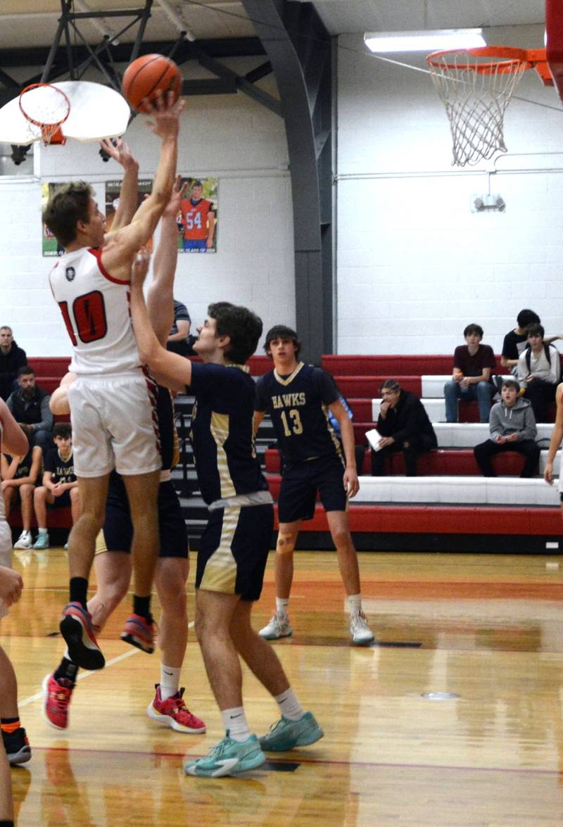 LaMoille's Connor Deering shoots against Hiawatha Wednesday night at Dean Madsen Gymnasium. The Lions won 62-54.