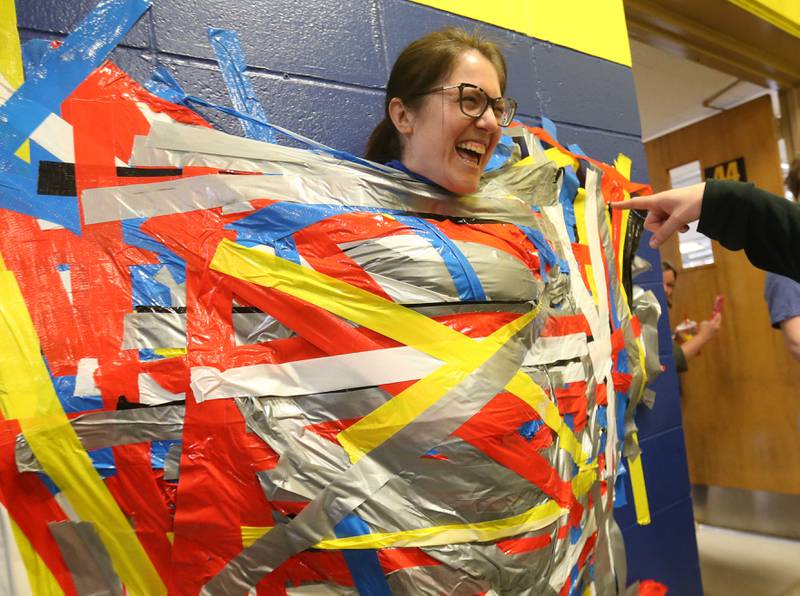 Social studies teacher Rebecca Shepherd reacts during the "Tape The Teacher" fundraiser on Friday, March 20, 2026 at Logan Jr. High School in Princeton.