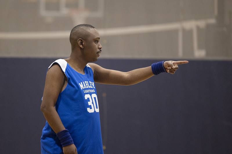 Harold points during the Special Olympic basketball practice Wednesday, Dec. 18, 2024. Many of the players on the team are deaf, so coaching and officiating the team is an extra skill.