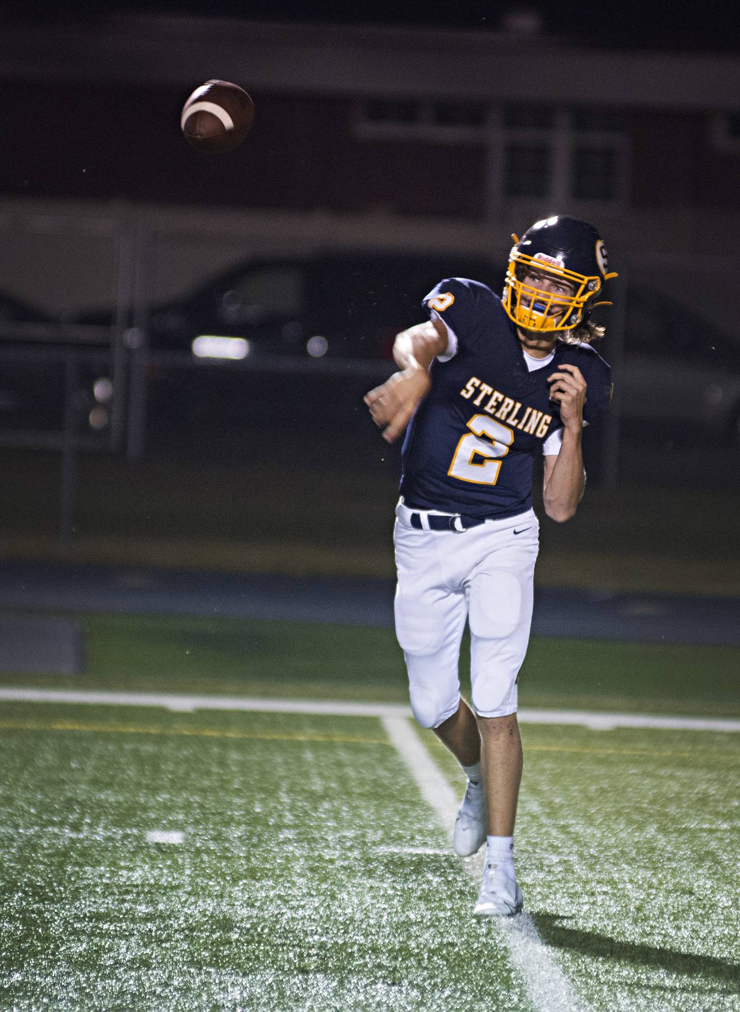 Sterling's Garrett Polson fires a pass Friday against Montini.